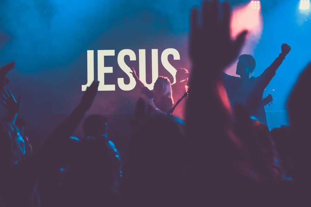 Congregation worshipping with hands raised