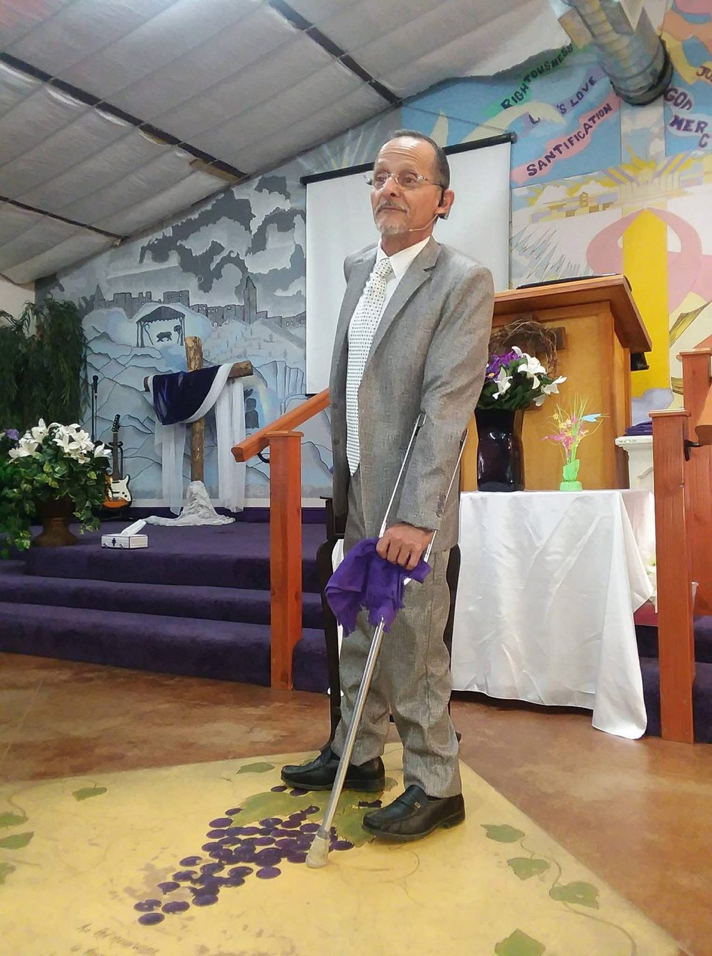 Pastor Roberto Valadez at the front of the sanctuary